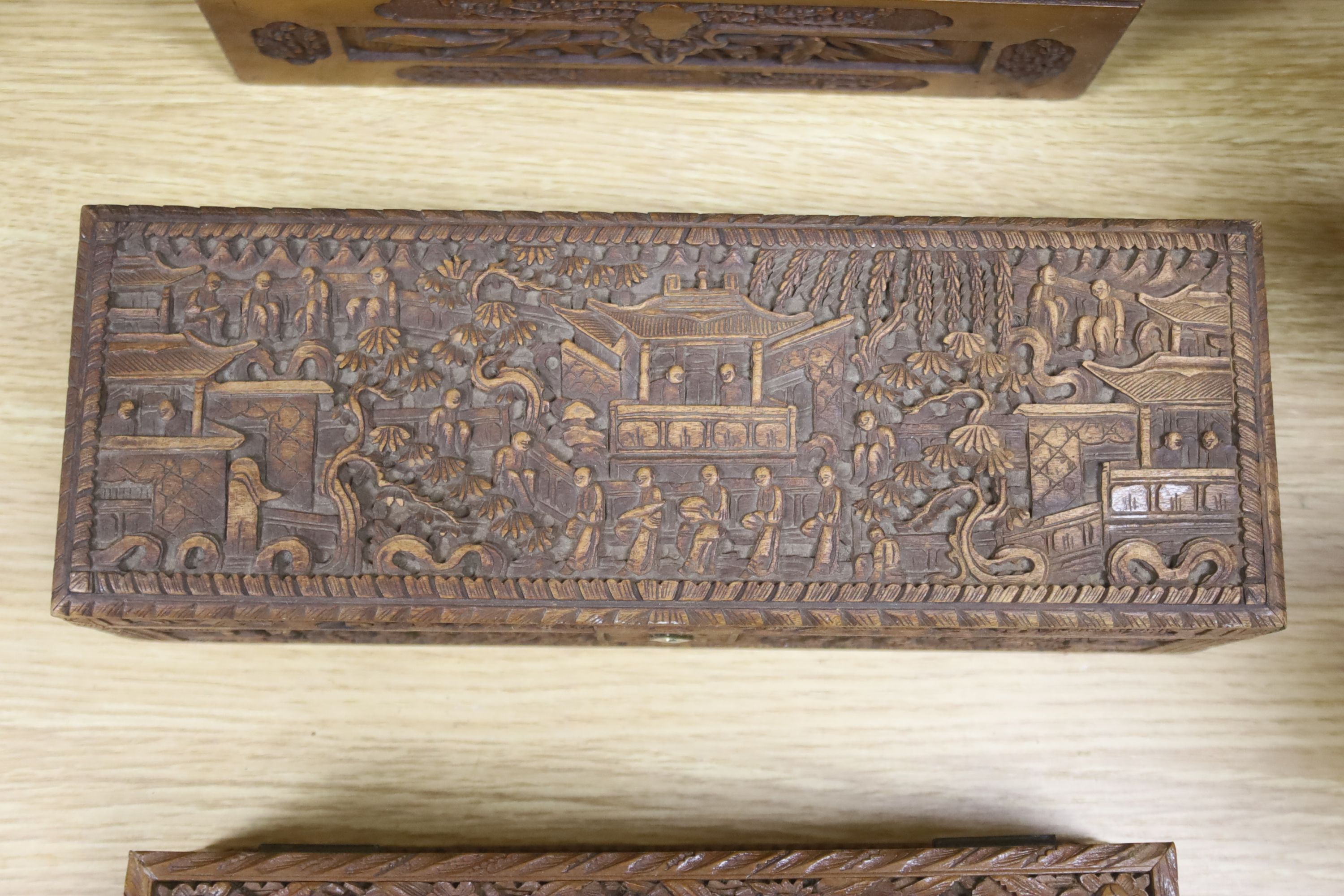 Three 19th century Chinese carved sandalwood boxes, 19th/20th century, longest 30cm